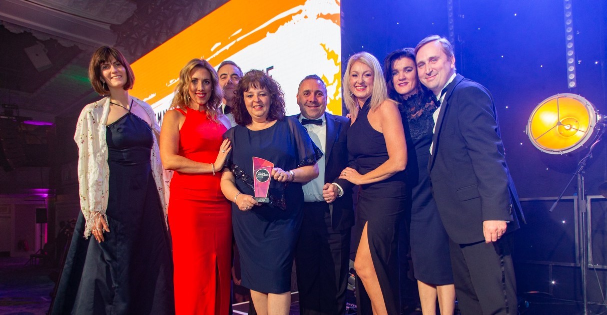 Photo of our team collecting the award