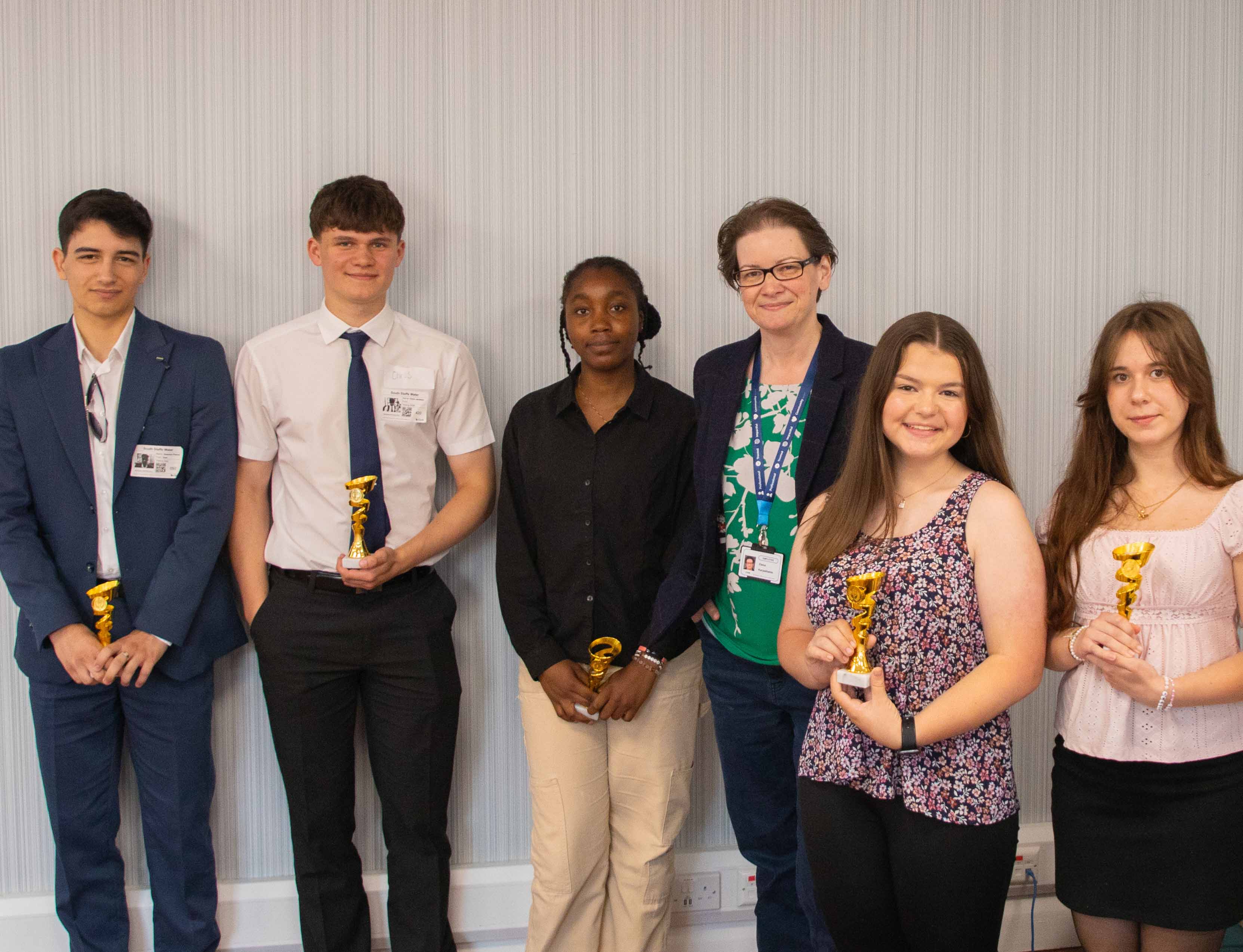 Managing Director, Elena Karpathakis standing with the winning team from the Young Innovators' Panel pitch